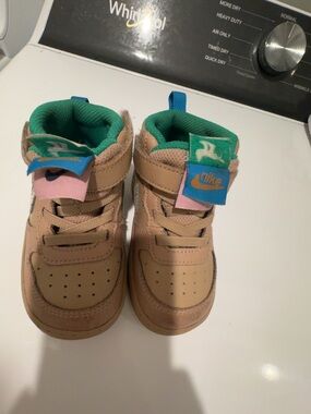 Nike Kids Tan High-Top Sneakers with Green Lining and Blue/Pink Tongue Accents s